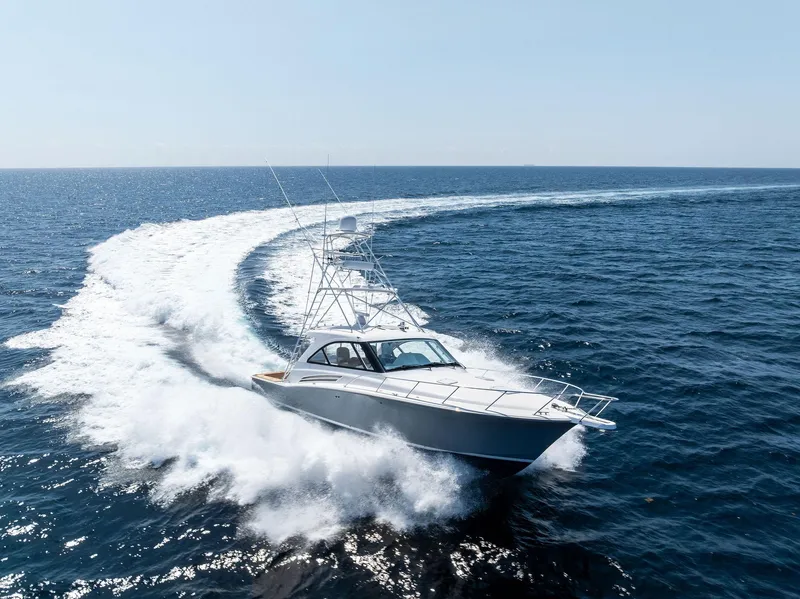 Slide: The Image of 2016 Hatteras Express Sportfish cruising swiftly on open ocean waters. - 10