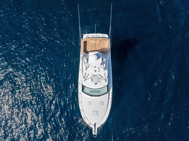 Slide: The Image of Aerial view of 2016 Hatteras Express Sportfish yacht on deep blue ocean. - 16
