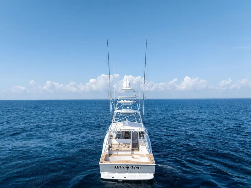 Slide: The Image of 2016 Hatteras Express Sportfish yacht on open ocean under clear blue sky. - 20