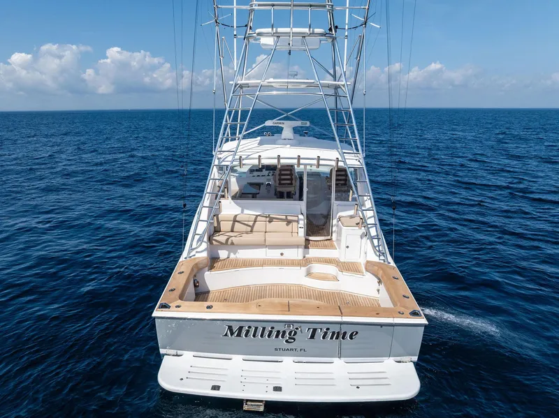 Slide: The Image of 2016 Hatteras Express Sportfish yacht on open ocean, rear view. - 22