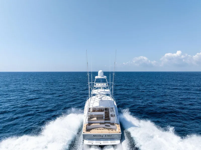 Slide: The Image of 2016 Hatteras Express Sportfish cruising on open ocean under clear blue sky. - 3
