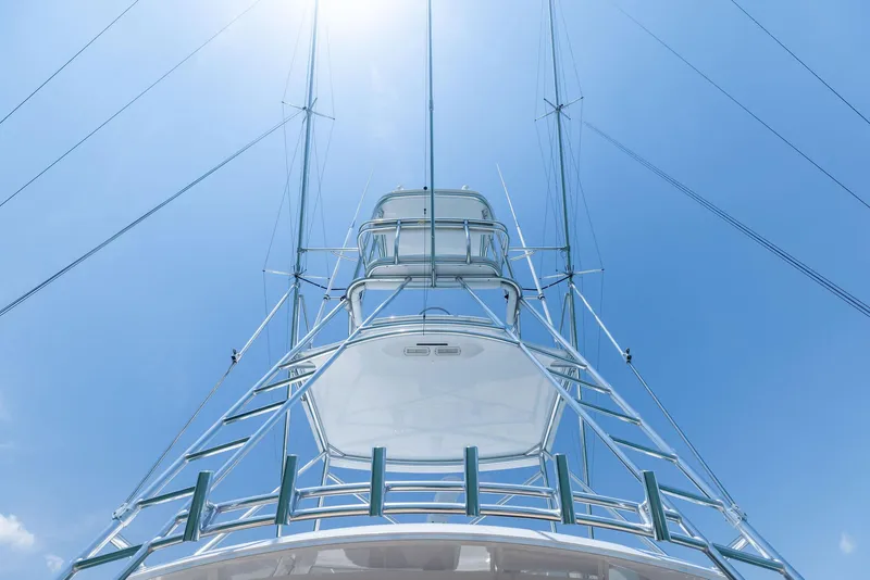 Slide: The Image of 2016 Hatteras Express Sportfish yacht tower against a clear blue sky. - 36
