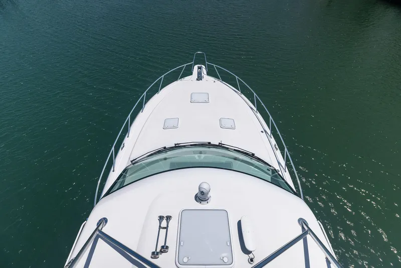 Slide: The Image of 2016 Hatteras Express Sportfish yacht bow on calm water. - 41