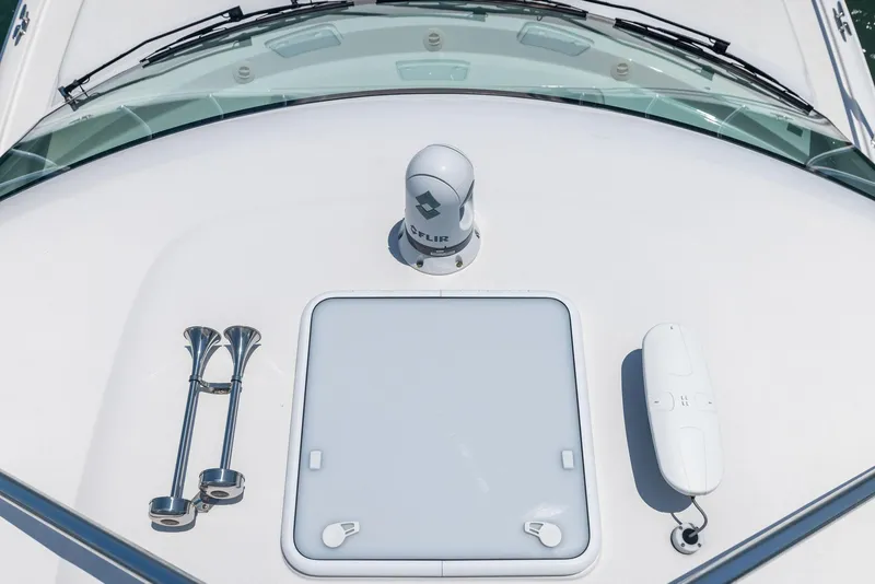 Slide: The Image of 2016 Hatteras Express Sportfish boat deck with radar and hatch. - 42