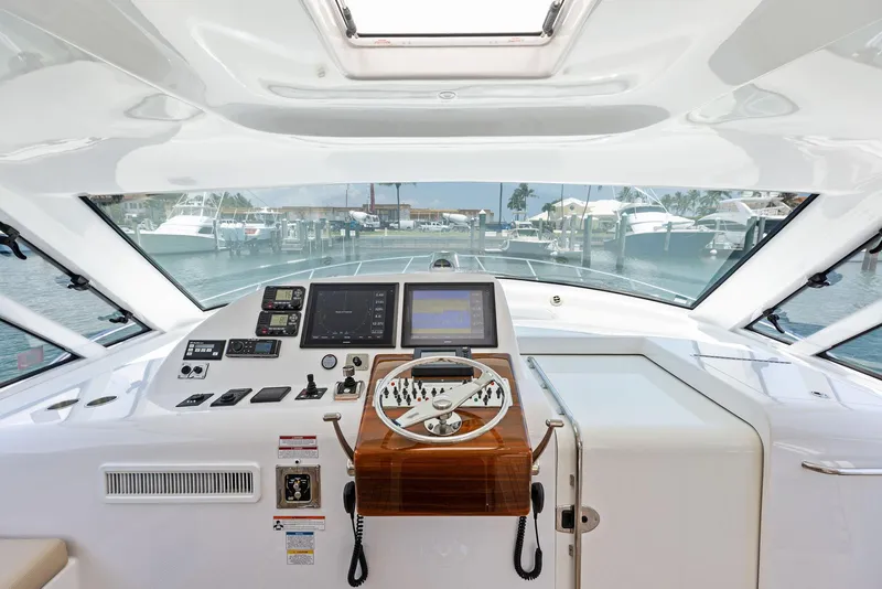 Slide: The Image of Helm of 2016 Hatteras Express Sportfish yacht with modern navigation equipment. - 45