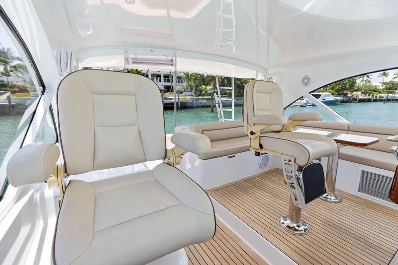 Slide: The Image of 2016 Hatteras Express Sportfish interior with plush seating and sleek design. - 46