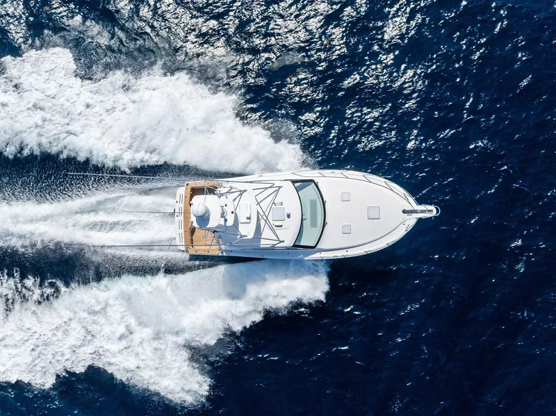 Slide: The Image of 2016 Hatteras Express Sportfish cruising on open ocean waters. - 6