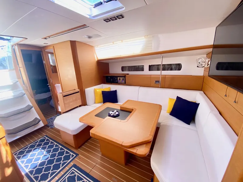 Slide: The Image of Interior of 2016 Jeanneau Sun Odyssey 479 yacht with modern seating and decor. - 10