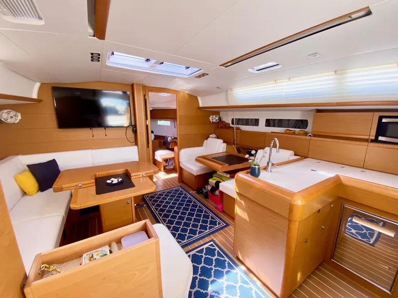 Slide: The Image of Luxurious interior of 2016 Jeanneau Sun Odyssey 479 yacht with modern kitchen and seating area. - 15
