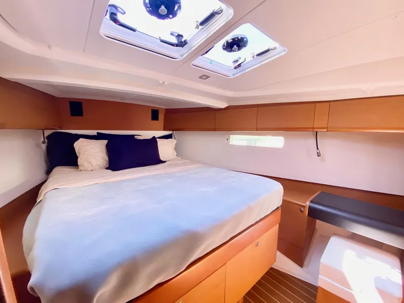 Slide: The Image of Luxurious cabin interior of 2016 Jeanneau Sun Odyssey 479 yacht with skylights and cozy bedding. - 3
