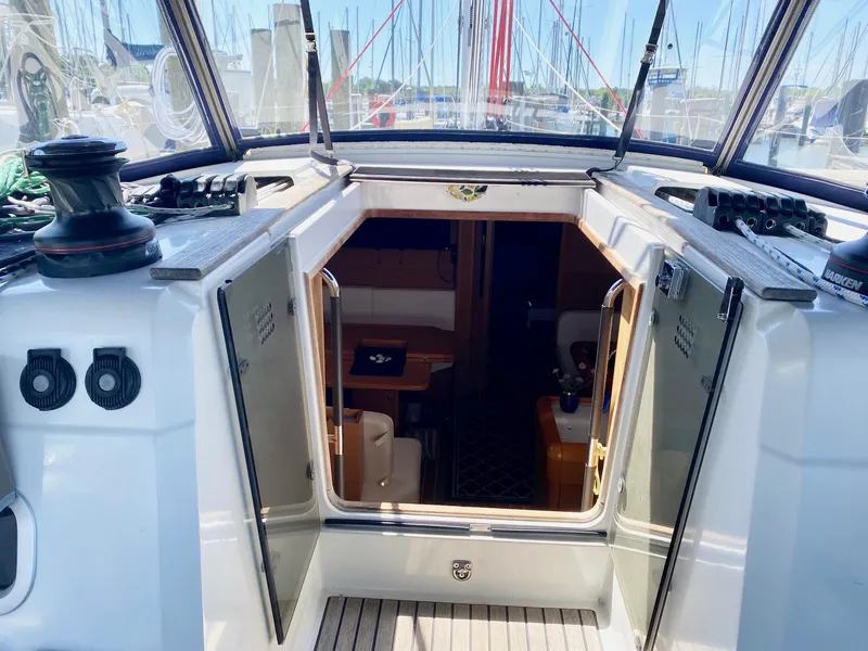 Slide: The Image of 2016 Jeanneau Sun Odyssey 479 yacht cockpit with open cabin entrance. - 30