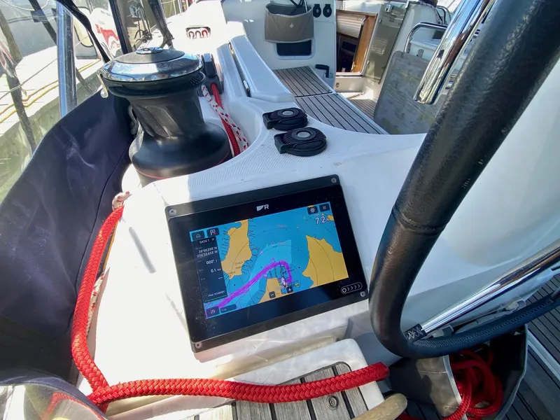 Slide: The Image of Cockpit of 2016 Jeanneau Sun Odyssey 479 with navigation display and winch. - 31