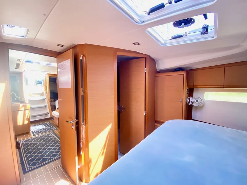 Slide: The Image of Interior of 2016 Jeanneau Sun Odyssey 479 yacht, featuring wood finish and natural light. - 5