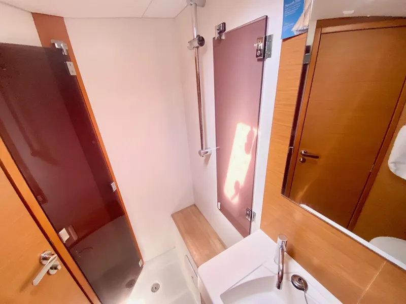 Slide: The Image of Bathroom interior of 2016 Jeanneau Sun Odyssey 479 yacht, featuring shower and sink. - 6