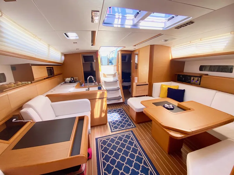 Slide: The Image of Luxurious interior of 2016 Jeanneau Sun Odyssey 479 yacht with modern furnishings and natural light. - 9