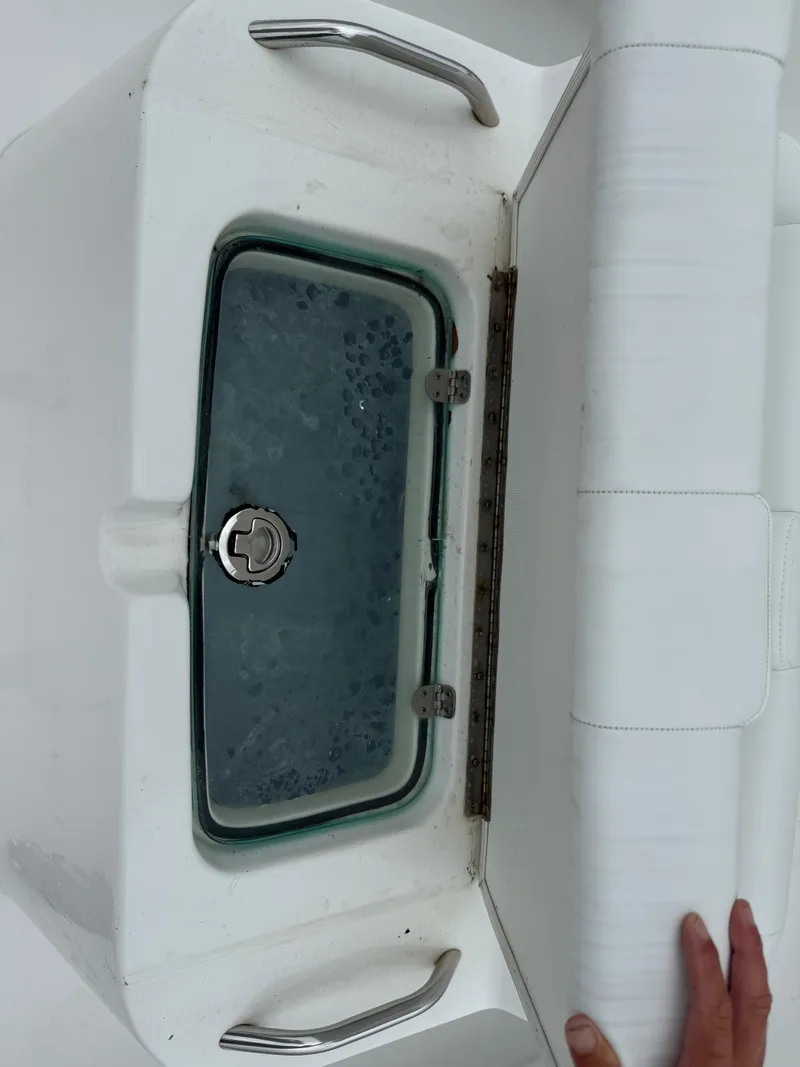 Slide: The Image of Livewell on a 2019 Cape Horn 31 boat, partially open with water inside. - 11