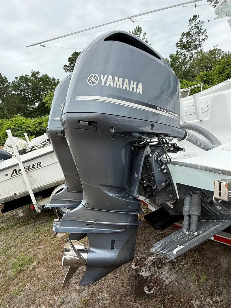 Slide: The Image of Twin Yamaha outboard motors on a 2019 Cape Horn 31 boat, parked outdoors. - 15