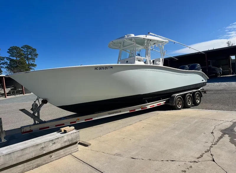 Slide: The Image of 2019 Cape Horn 31 boat on trailer under clear blue sky. - 5