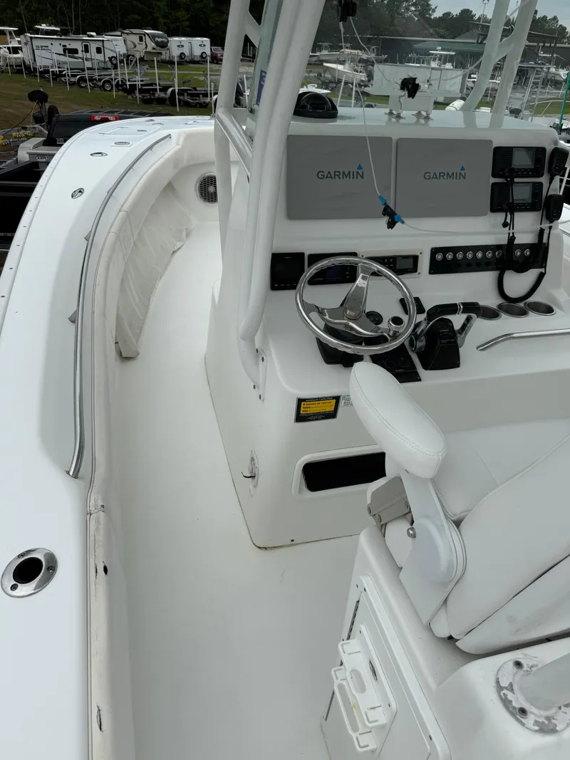 Slide: The Image of 2019 Cape Horn 31 boat cockpit with Garmin navigation system and white seating. - 10