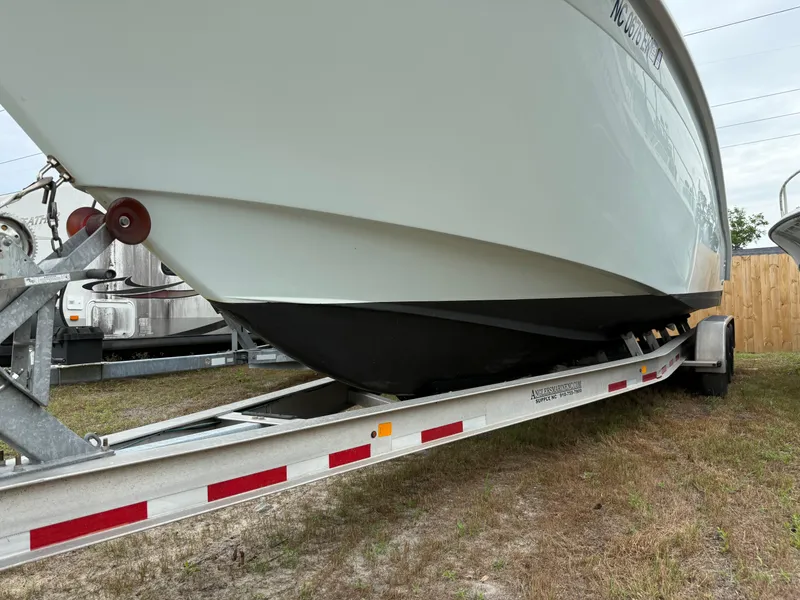 Slide: The Image of 2019 Cape Horn 31 boat on trailer, side view, parked on grass. - 18