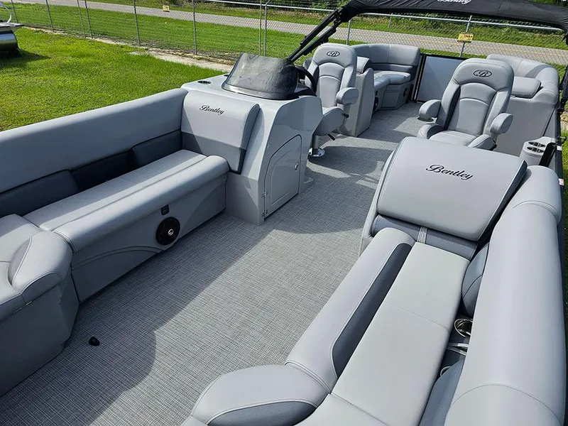 Slide: The Image of 2025 Bentley Pontoons Legacy 243 Navigator interior with luxurious gray seating. - 12