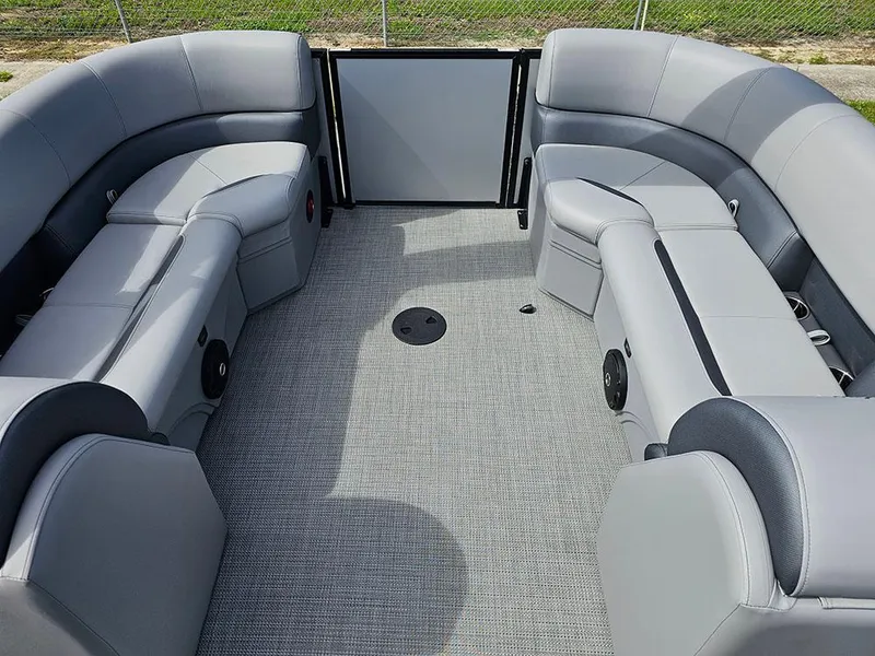 Slide: The Image of 2025 Bentley Pontoons Legacy 243 Navigator interior with plush seating and modern helm. - 13