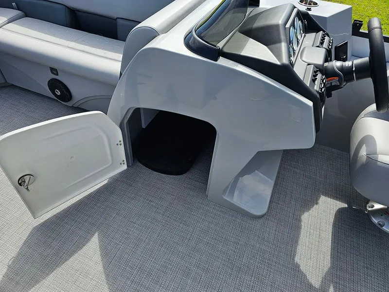Slide: The Image of 2025 Bentley Pontoons Legacy 243 Navigator interior with luxurious seating and cup holders. - 18