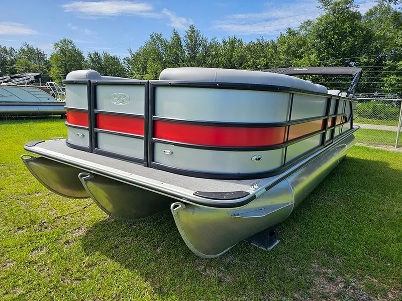 Slide: The Image of 2025 Bentley Pontoons Legacy 243 Navigator on grass under blue sky. - 5
