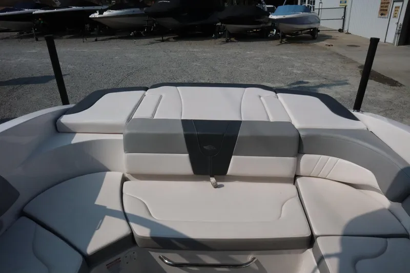 Slide: The Image of 2020 Chaparral 23 SSi boat interior with white and gray seating. - 11