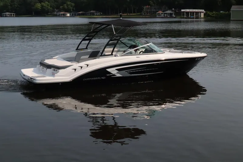 Slide: The Image of 2020 Chaparral 23 SSi boat cruising on a calm lake. - 5