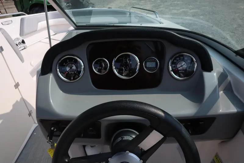 Slide: The Image of Dashboard of 2020 Chaparral 23 SSi boat with gauges and steering wheel. - 9