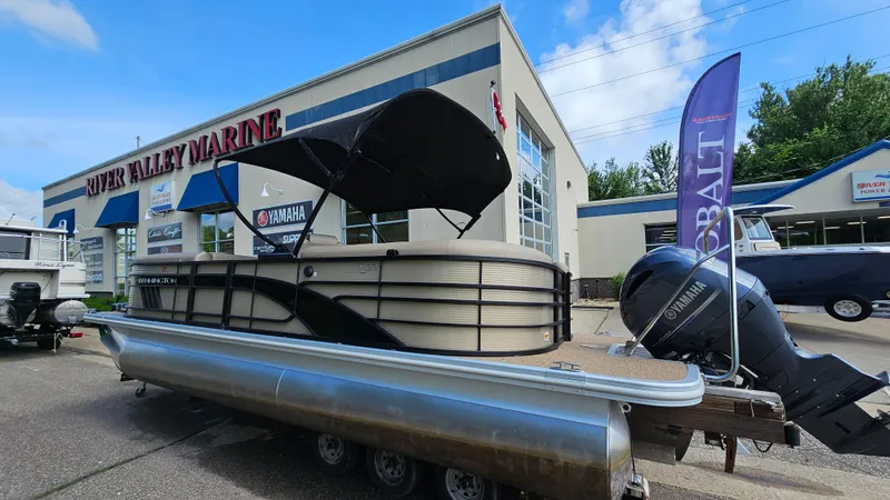 Slide: The Image of 2021 Bennington L 22 Quad Bench pontoon boat at River Valley Marine dealership. - 2
