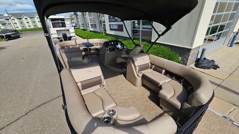 Slide: The Image of 2021 Bennington L 22 Quad Bench pontoon boat with spacious seating and modern design. - 21