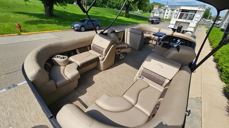 Slide: The Image of 2021 Bennington L 22 Quad Bench pontoon boat with luxurious seating and modern design. - 22
