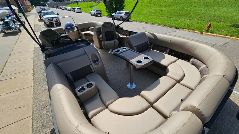 Slide: The Image of 2021 Bennington L 22 Quad Bench pontoon boat with spacious seating and table. - 24