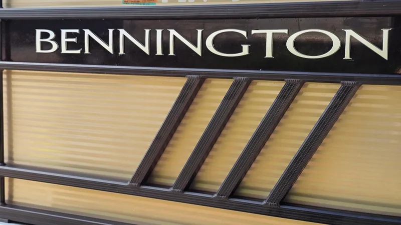 Slide: The Image of Bennington L 22 Quad Bench 2021 logo on boat exterior. - 26