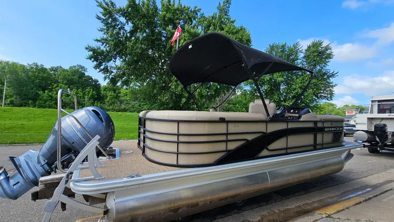 Slide: The Image of 2021 Bennington L 22 Quad Bench pontoon boat with canopy on trailer. - 3