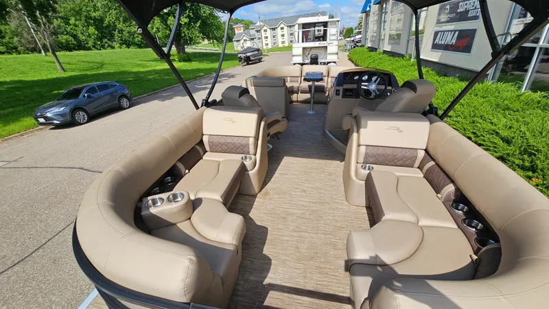 Slide: The Image of 2021 Bennington L 22 Quad Bench pontoon boat with luxurious seating and modern design. - 8