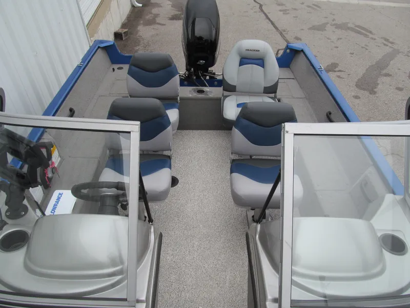 Slide: The Image of 2011 Tracker Pro Guide V-16 WT boat interior with seating and steering console. - 12