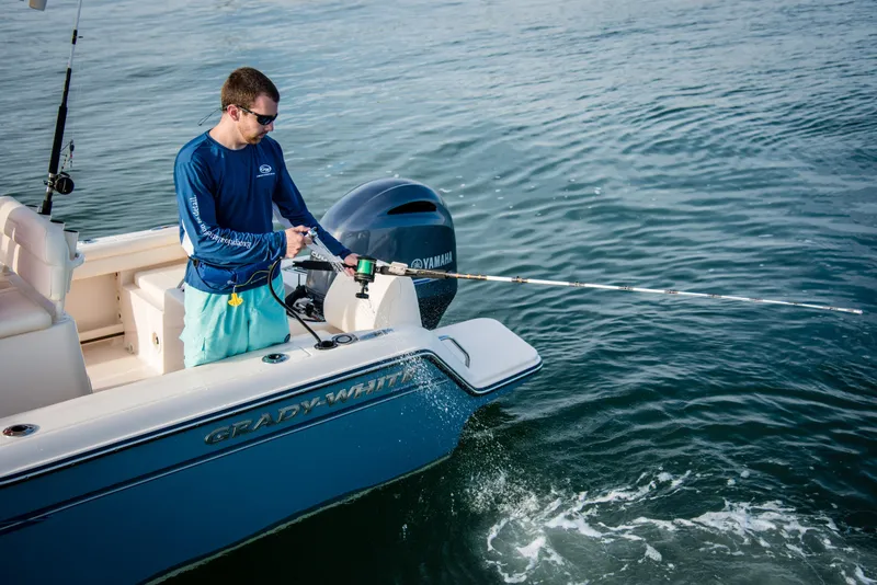 Slide: The Image of Man fishing on a 2026 Grady-White Fisherman 216 boat in open water. - 12