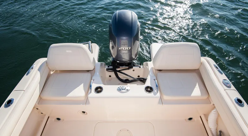 Slide: The Image of 2026 Grady-White Fisherman 216 boat with dual seats and powerful outboard motor on water. - 5