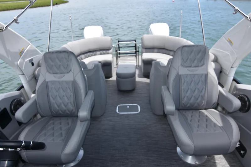 Slide: The Image of 2024 Bennington 27 QFB boat interior with luxurious gray seating and spacious layout. - 44