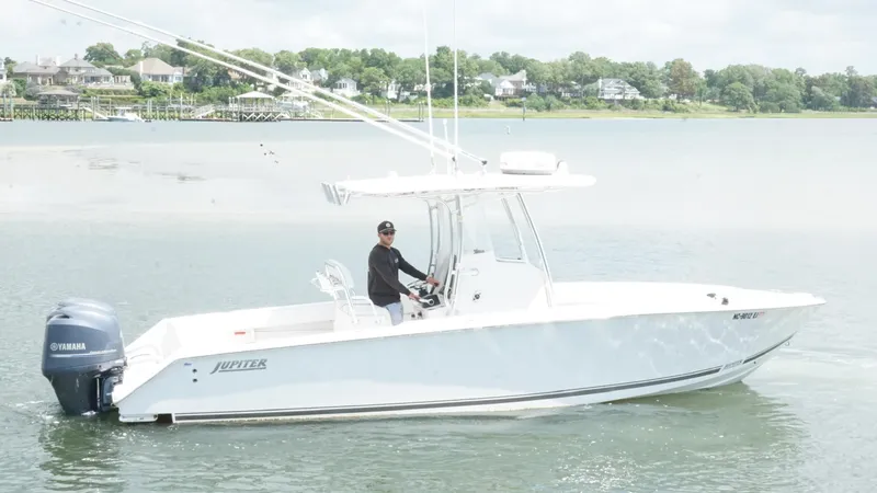 Slide: The Image of A 2012 Jupiter 26 boat with Yamaha engine on calm water. - 5