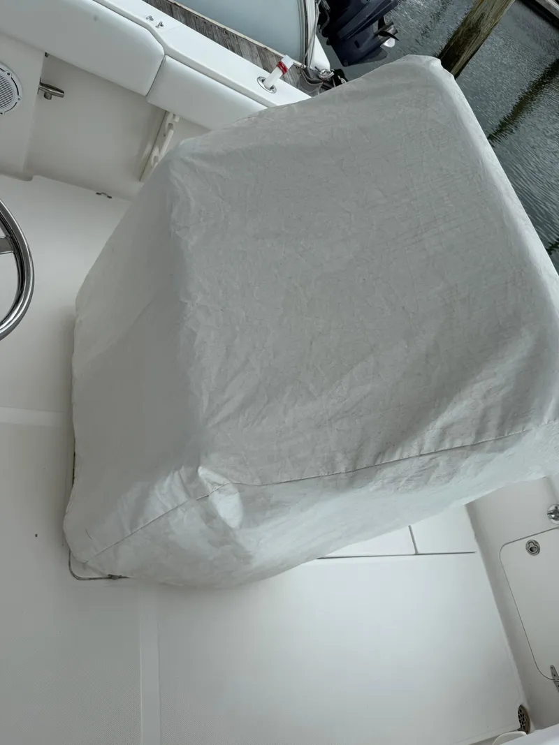 Slide: The Image of Covered console on a 2012 Jupiter 26 boat deck. - 9