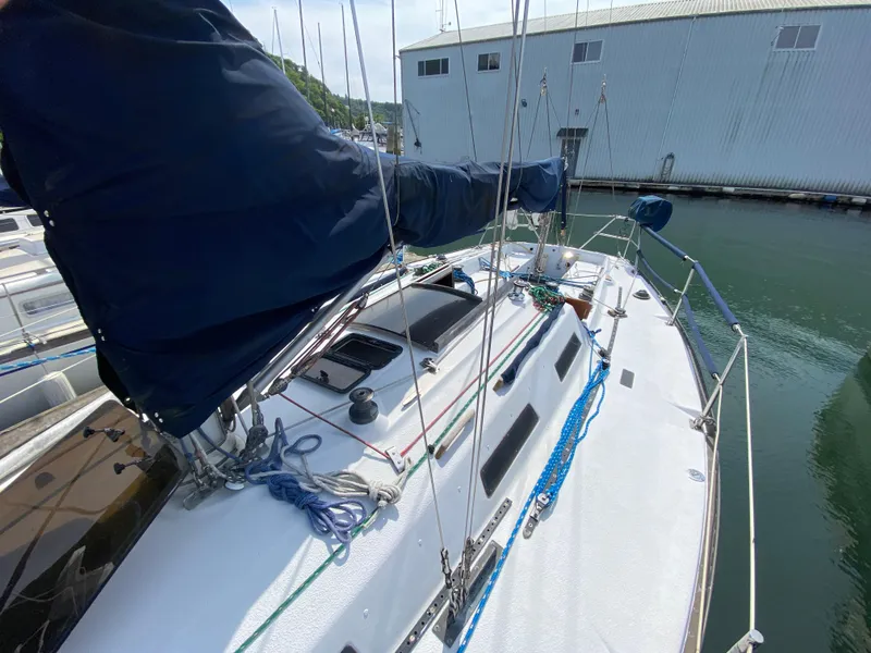 Slide: The Image of 1979 Santana 35 sailboat docked, featuring deck and rigging details. - 4
