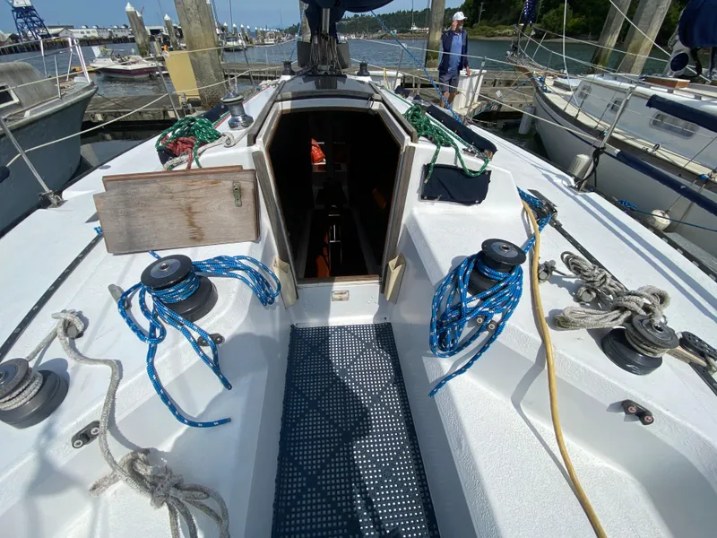 Slide: The Image of Cockpit of a 1979 Santana 35 sailboat with ropes and winches at a marina. - 9