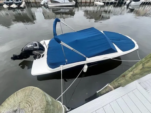 The Image of 2019 Sea Ray SPX 190 OB boat docked in a residential canal. - 0