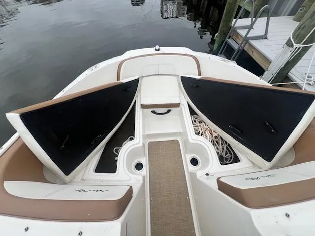 Slide: The Image of 2019 Sea Ray SPX 190 OB boat bow with open storage compartments. - 13