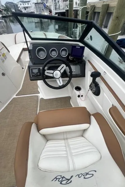 Slide: The Image of 2019 Sea Ray SPX 190 OB boat interior with steering wheel and dashboard. - 4