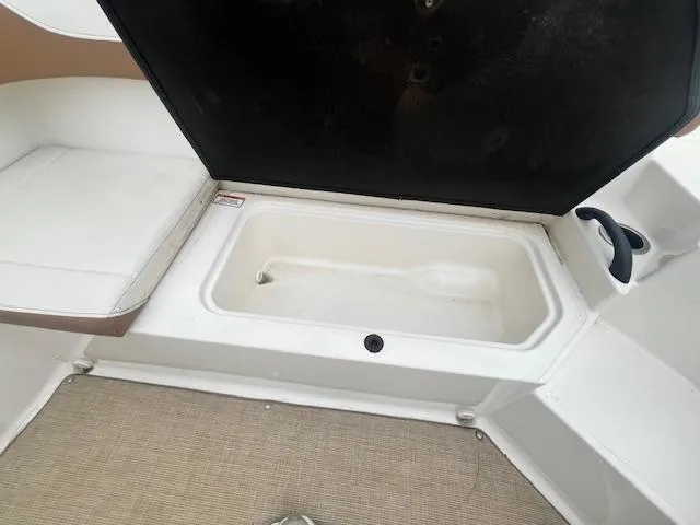 Slide: The Image of Open storage compartment on a 2019 Sea Ray SPX 190 OB boat. - 7